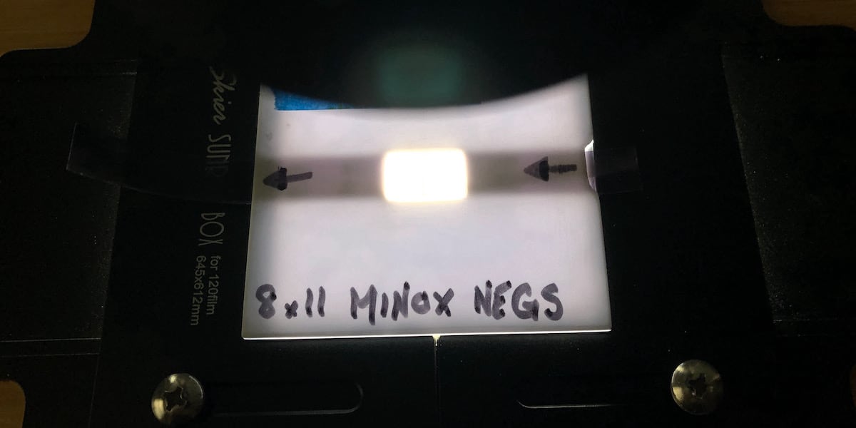 A custom Minox 8x11 negative carrier made from styrene