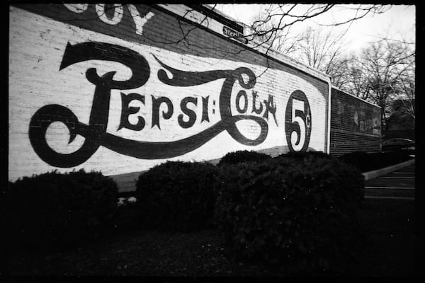 'Pepsi Cola' painted on a building