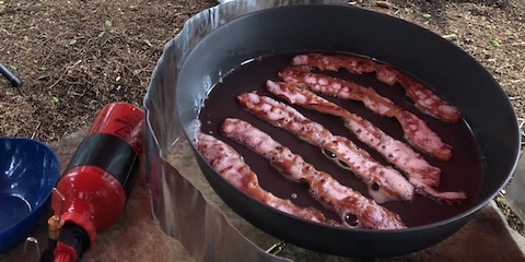 Cooking bacon for breakfast in the fry-bake