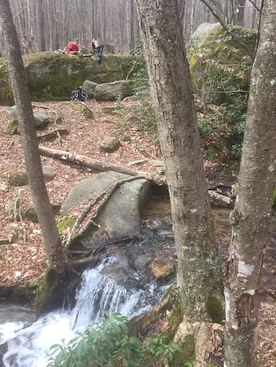 A small waterfall near a creek crossing