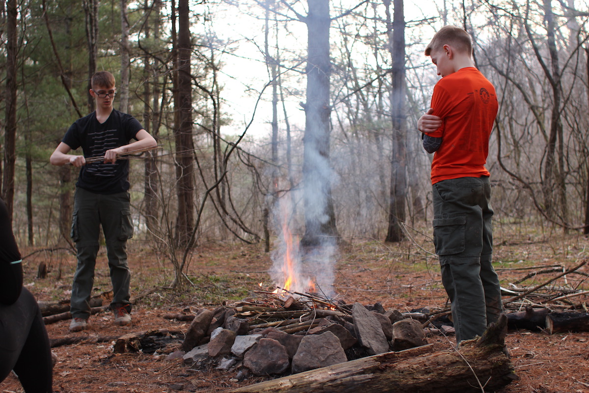 Getting a small campfire started at our first campsite