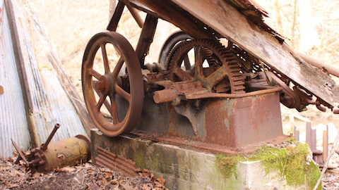 The remnants of a rusty old oil pump